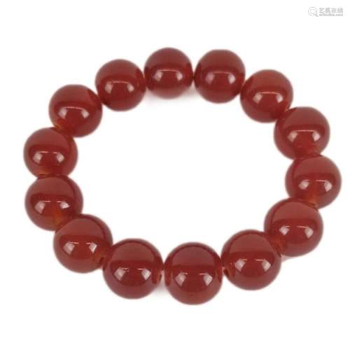 AÂ Red Agate bracelet with 14 beads bound by elastic