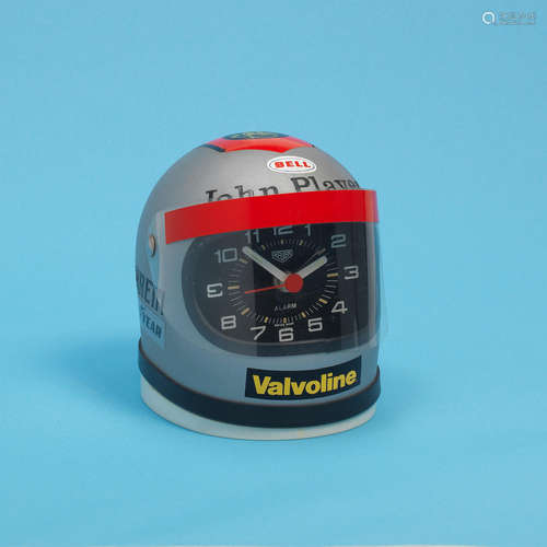 Mario Andretti John Player, Circa 1975  Heuer. A miniature 'Cavallino' racing helmet desk clock with alarm