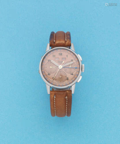 Circa 1950  Heuer. A stainless steel manual wind triple calendar chronograph wristwatch