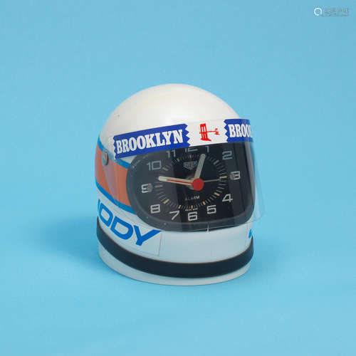 Jody Scheckter, Circa 1975  Heuer. A miniature 'Cavallino' racing helmet desk clock with alarm