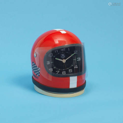 Formula 1 Red, Ref: 44915, Circa 1980  TAG Heuer. A miniature racing helmet desk clock with alarm