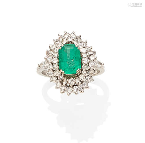 An emerald, diamond and 18k white gold ring