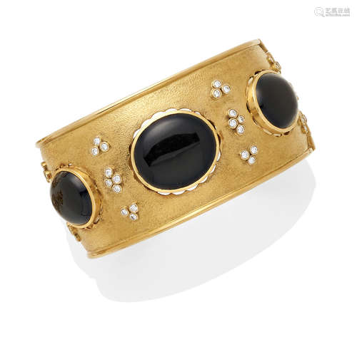 A diamond, black onyx and 14K gold hinged bangle,  Julius Cohen