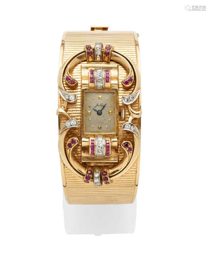 A retro ruby, diamond and gold bangle wristwatch