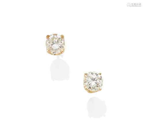 A pair of diamond and 14k gold stud earrings