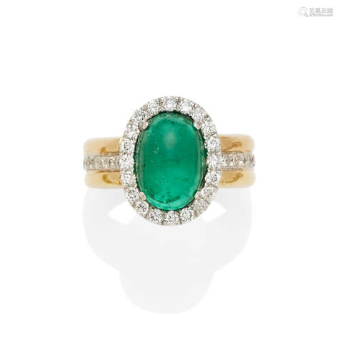 An emerald, diamond and 18k bi-color gold ring