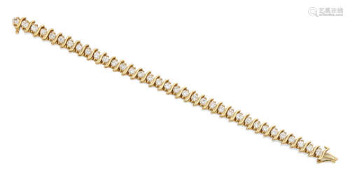 A diamond and 14k gold bracelet