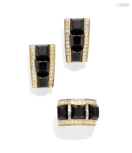 A diamond, black onyx and 18K gold ring and matching ear clips