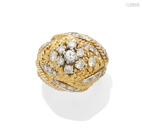 A diamond and gold dome ring