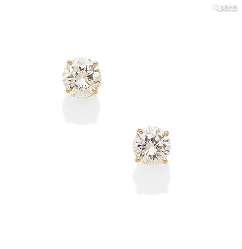 A pair of diamond and 14k gold stud earrings