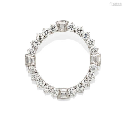 A diamond and platinum circle brooch