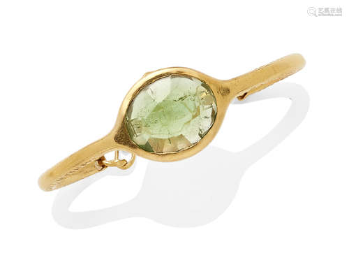 A green tourmaline and 22K gold cuff bangle