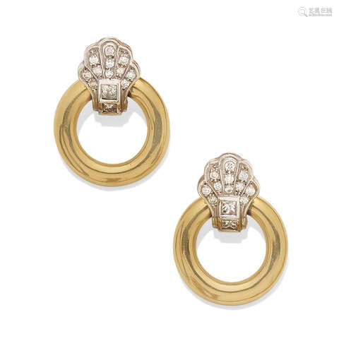 A pair of diamond and bi-color gold doorknocker ear clips