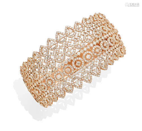 A diamond and 18k rose gold bangle