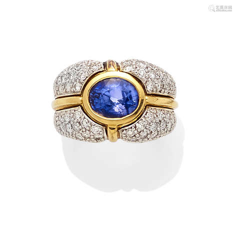 A sapphire, diamond and 18k bi-color gold ring