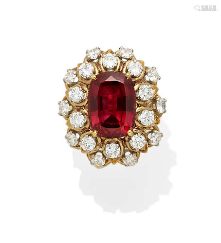 A synthetic ruby, diamond and bi-color gold ring