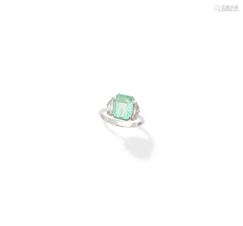 An emerald and diamond ring