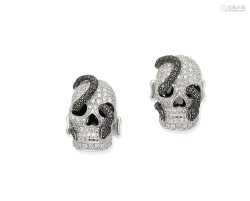 A pair of diamond and black diamond skull cufflinks, by Theo Fennell