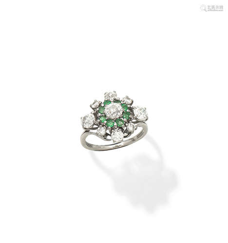 An emerald and diamond dress ring