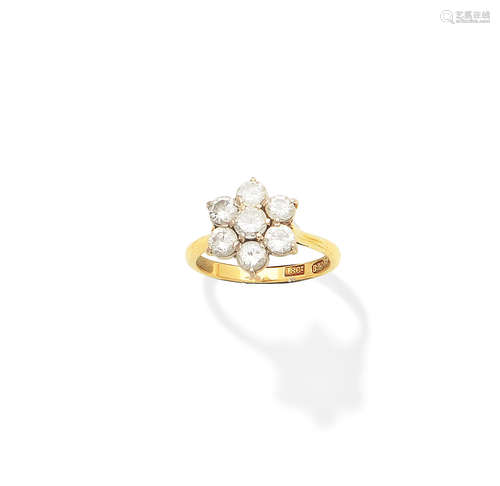 A diamond cluster ring, by Boodle & Dunthorne