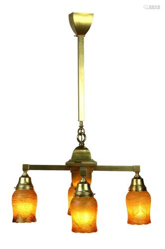 Arts and Crafts hanging fixture circa 1915, the gilt support with threaded bell form shades