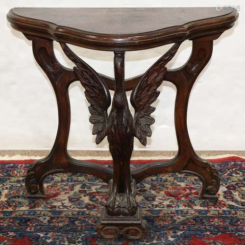 Classical style mahogany console table, having a shaped top, above a swan form support, 23