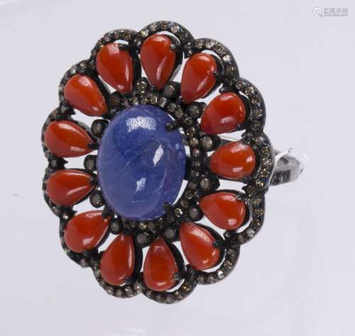 Tanzanite, coral, diamond and blackened silver ring Centering (1) oval tanzanite cabochon, measuring