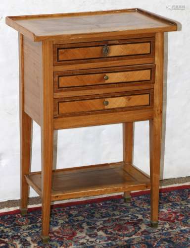 French Empire inlaid commode, circa 1820, having a rectangular top, above the three drawer case, and