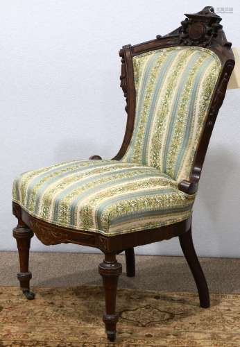 Victorian walnut sidechair, having a shield form crest above the contoured back and rising on