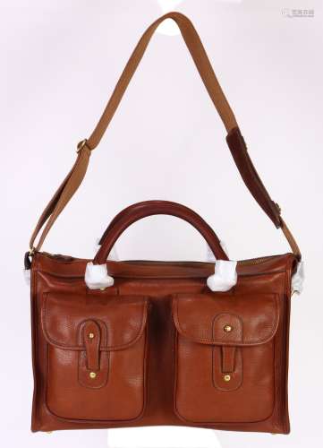 Ghurka leather travel bag, executed in brown, having a double handle with attached leather strap,