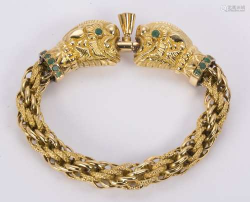 Emerald and 22k yellow gold creature bracelet Designed as (2) opposing mythical creature heads,