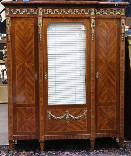 French Neoclassical style marquetry decorated vitrine, with brass mounts, having a shaped top, above