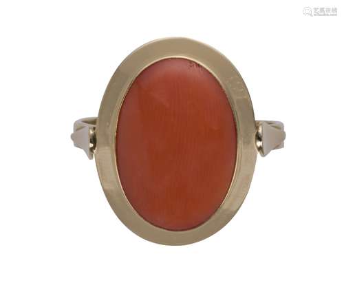 Coral and 18k yellow gold ring Featuring (1) oval coral cabochon, measuring approximately 15.30 X