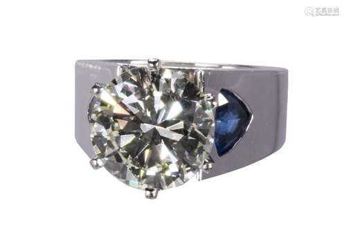 Diamond, sapphire and 14k white gold ring Featuring (1) round brilliant-cut diamond, weighing 5.87