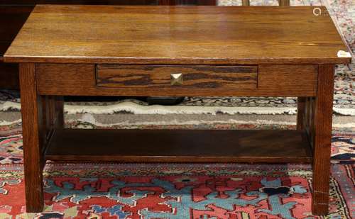 Arts and Crafts style oak low table, having a rectangular top, above slatted sides, continuing to