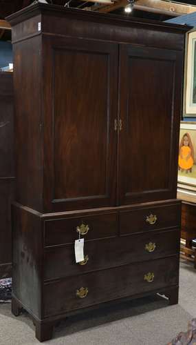 Georgian mahogany chest on chest, having a molded top above paneled door, continuing to the four