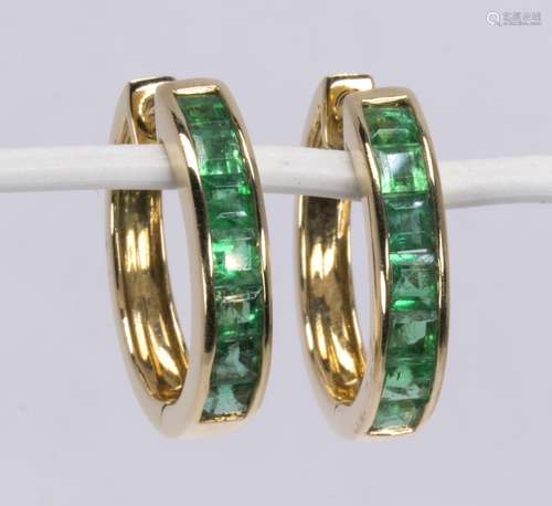 Pair of emerald and 14k yellow gold earrings Featuring (14) square-cut emeralds, weighing a total of