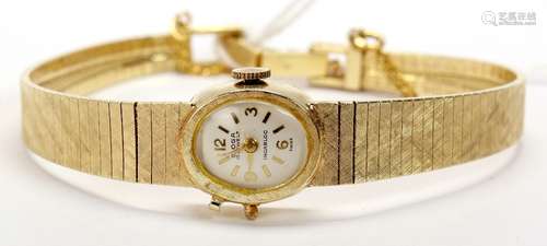 Lady's 14k yellow gold wristwatch Dial: cushion, off white, applied gold tone Arabic and baton