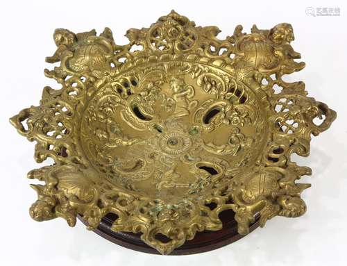 Rococo style gilt centerpiece, in the form of a pierced bowl, accented with putti, and rising on a