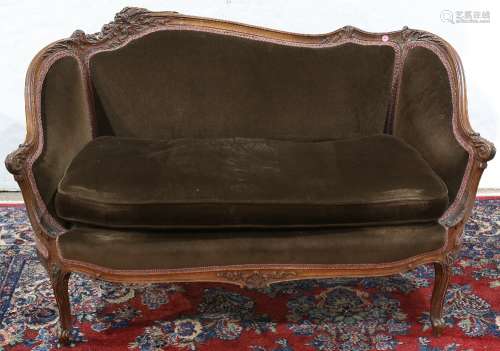 Louis XV style settee, having a floral carved crest rail, above brown upholstery, and rising on