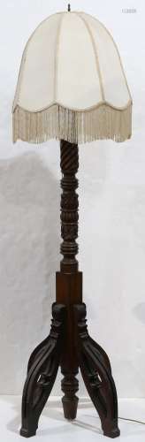 Victorian Gothic Revival floorlamp, having a carved standard with acanthus reserves, and rising on a