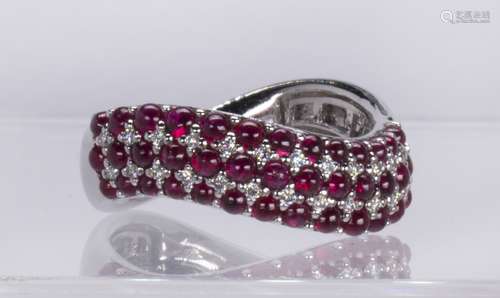 Ruby, diamond and 18k white gold ring Featuring (39) round ruby cabochons, weighing a total of