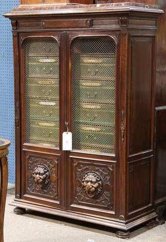 American mahogany bookcase, 19th century, having an inset marble top above the two door paneled