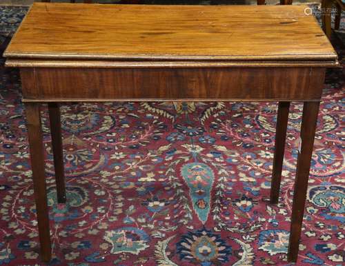 Federal mahogany card table, having a rectangular flip top, and rising on tapered legs, extended: