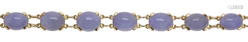 Jadeite and 18k yellow gold bracelet Featuring (10) oval lavender jadeite cabochons, ranging in size