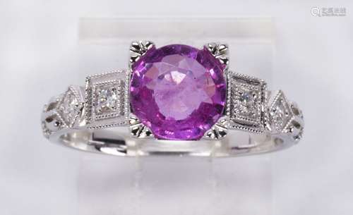 Sapphire, diamond and 14k white gold ring Featuring (1) round-cut pink sapphire, weighing