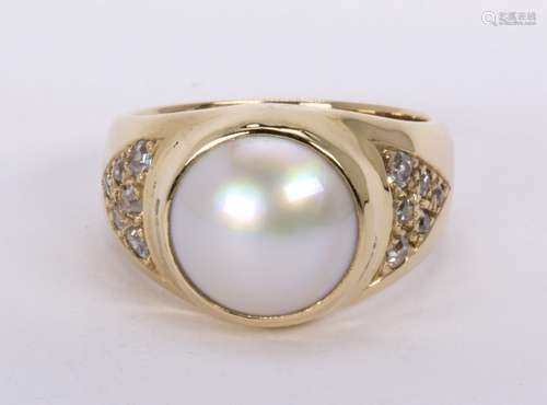 Mabe pearl, diamond and 14k yellow gold ring Featuring (1) mabe pearl, measuring approximately 9.