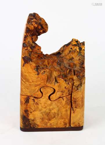 Maple burl puzzle box, having an organic form, opening to reveal a fitted interior, 8