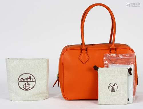 Hermes plume handbag, executed in orange, 28cm, retains dust bag, rain jacket, and original box,