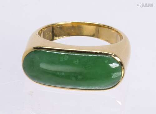 Jadeite and 18k yellow gold saddle ring Featuring (1) saddle shaped jadeite, measuring approximately